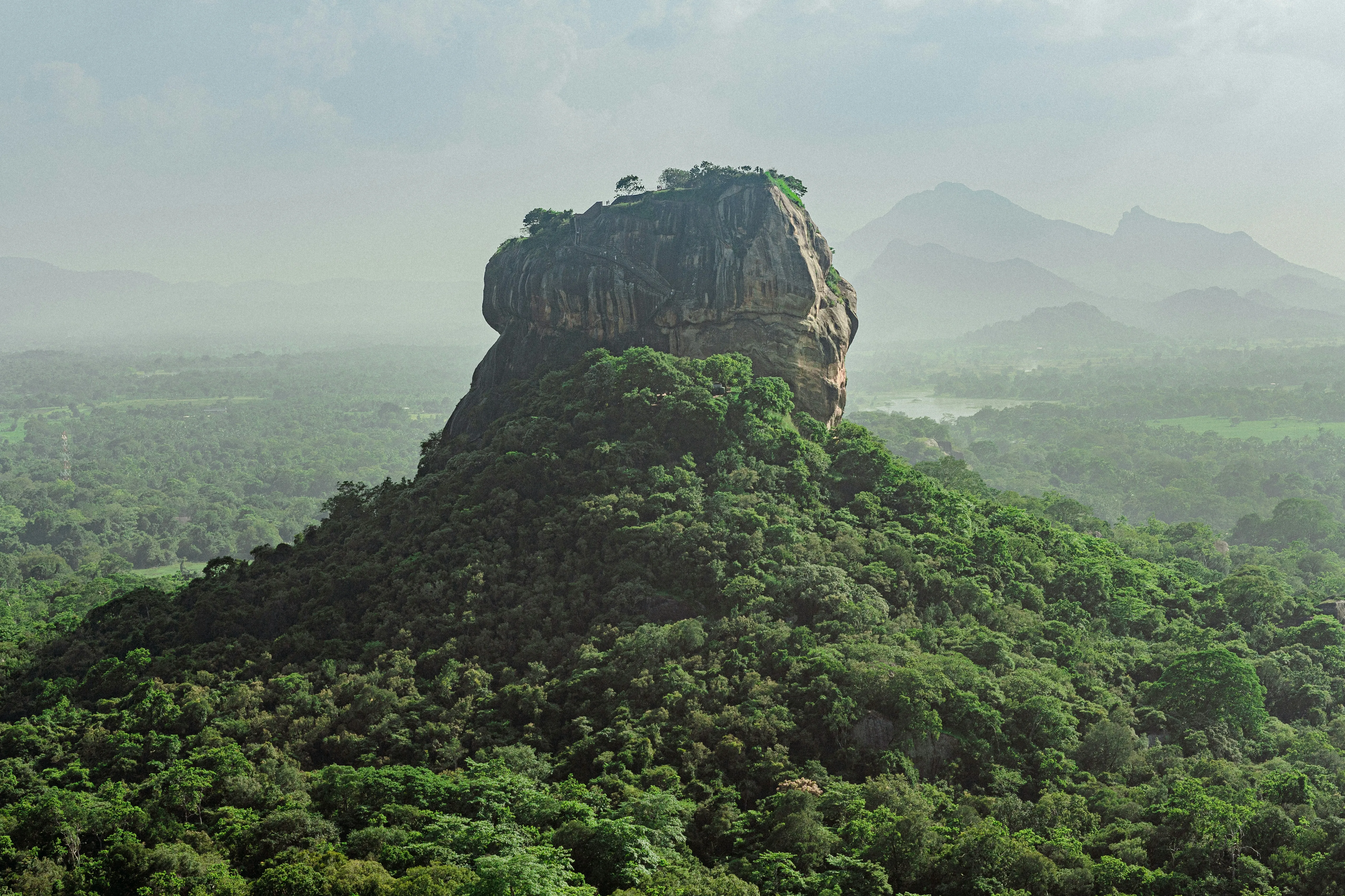Sigiriya Rock Fortress ancient palace towering over Sri Lanka's emerald forests